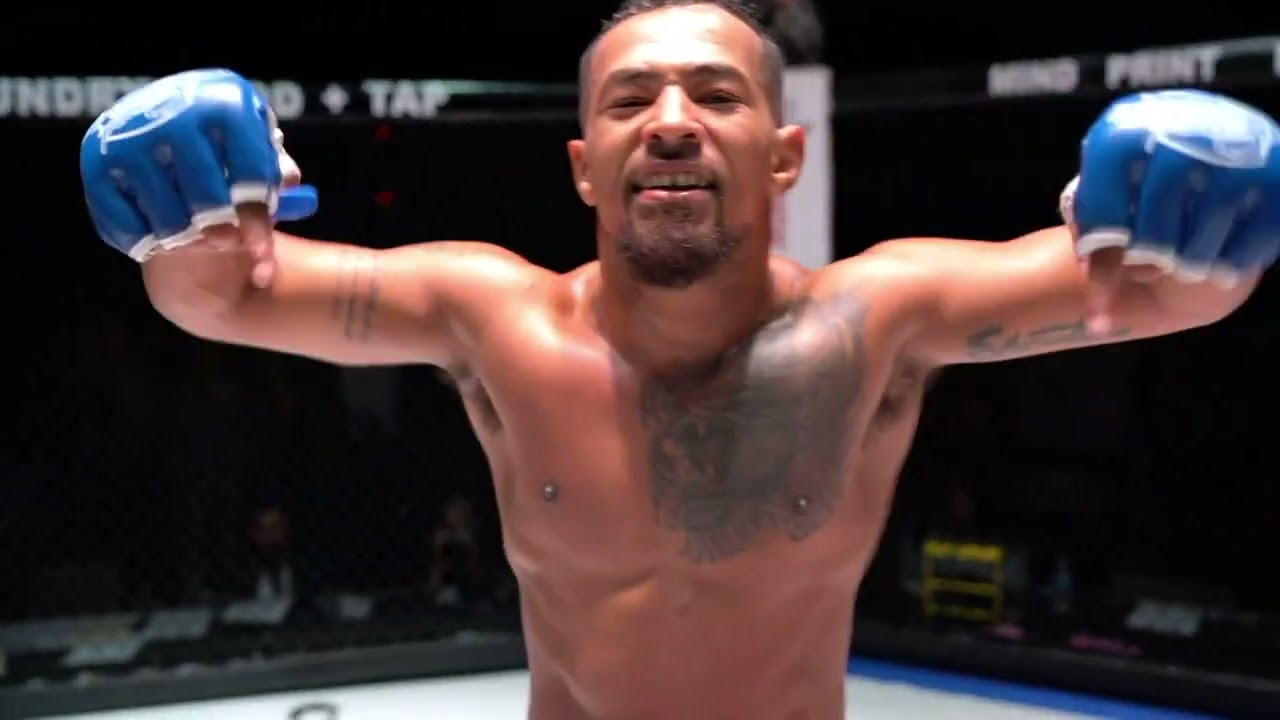 Eric Shelton celebrating victory in the octagon